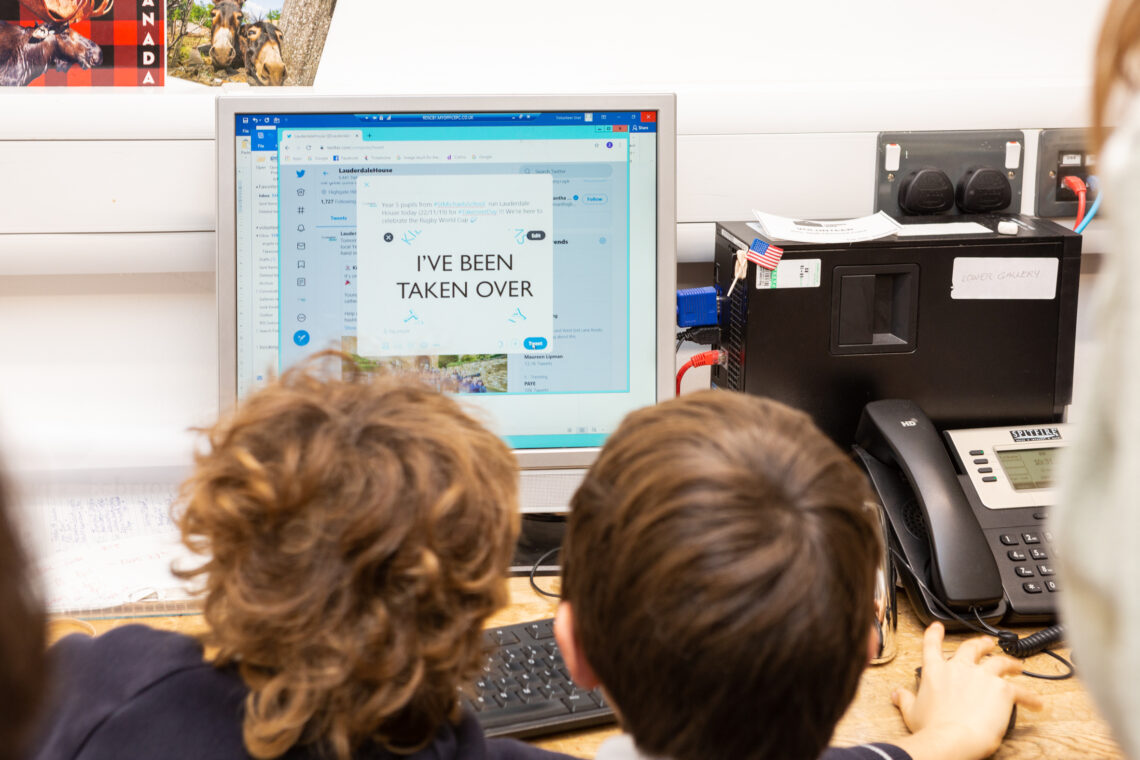 Two children sitting in front of a computer creating a Tweet for Museum Takeover Day